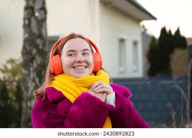 young happy carefree girl holds rose in her hands