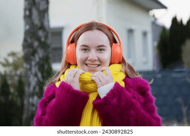 young happy carefree girl holds rose in her hands