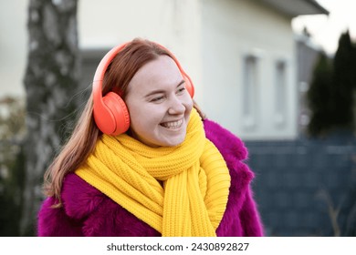 young happy carefree girl holds rose in her hands