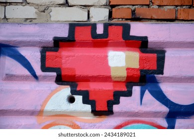 Fondo colorido de una obra de arte pintada con grafitis y brillantes contornos de aerosol en la pared. Obra de arte callejero de la vieja escuela hecha con latas de pintura en aerosol. Telón de fondo de la cultura juvenil contemporánea