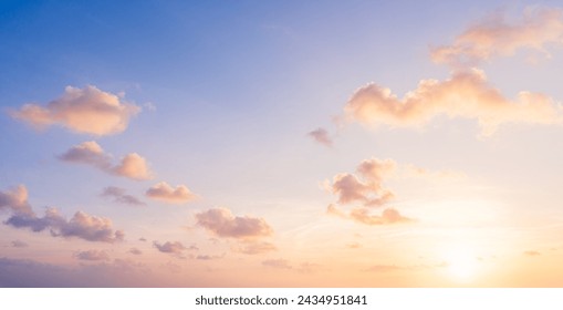 Sunset sky clouds in the evening summer with Orange, Yellow sunlight in Golden hour or morning sunrise, Horizon sky nature background