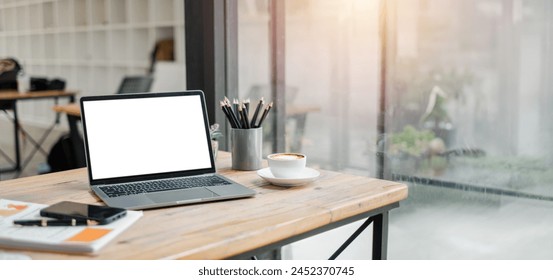 Blank screen laptop computer on office desk, Blank screen for product display..