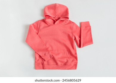Red sweatshirt mockup on the white background. Template sweatshirt front for design and print. Hoodie with pocket, long sleeve.  Basic clothing witout logo. Top view