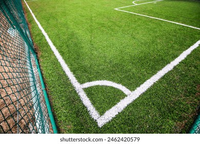 Corner point of an artificial turf football pitch in Denizli, Türkiye. Green grass and soccer field lines.