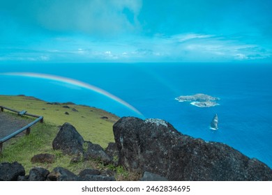 Birdman island near Easter Island with a rainbow before heavy rain in May