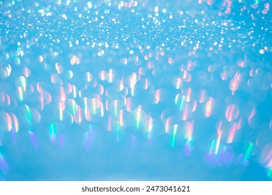 Small, defocused light points forming bokeh effect on gradient background, blue to white. Bokeh lights in blue, purple, pink, green hues. Ideal for backgrounds with depth, vibrant and dreamy aesthetic