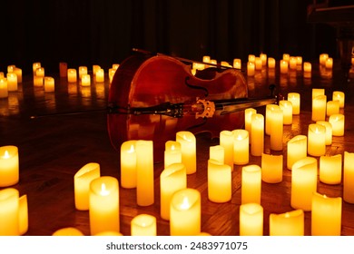 closeup of violin with lots of candles for design purpose