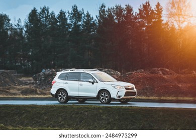Crossover SUV on countryside road with natural scenery