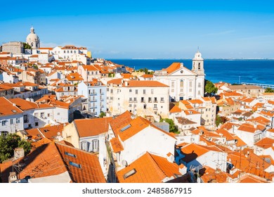 View of rooftops and skyline of Alfama district, the oldest neighborhood of Lisbon in Portugal