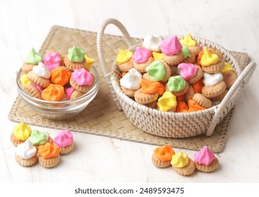 Gem Rose. Small round biscuits with colorful candy on top, usually this old school food is widely available when the holidays arrive.