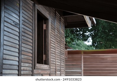 open window with old Thai wood house
