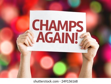 การ์ด Champs Again ที่มีพื้นหลังสีสันสดใสพร้อมแสงไฟที่เบลอ