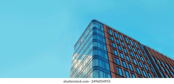 Architecture and real estate, residential apartment building with large panoramic windows, modern complex, angle view, blue sky background