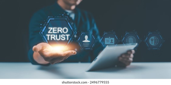 Embracing the zero trust security concept, a businessman holds a zero trust icon on a virtual screen, symbolizing enhanced business information security for the network.