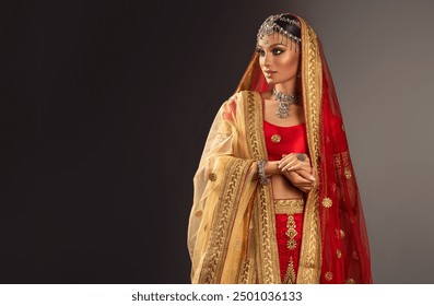 Portrait of beautiful indian bride woman  in a wedding dress .Beauty  Young hindu girl model with  jewelry set. Traditional India costume red lehenga choli or sari .  in a wedding dress
