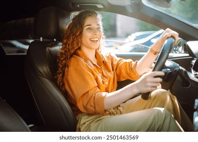 Portrait young woman driving car. Young traveler driving. Car travel, lifestyle concept.