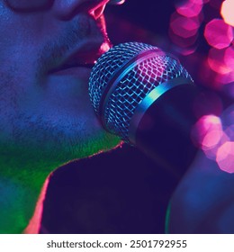Close-up photo of singer's face, bathed in colorful stage lights, captures electric energy and emotion of moment. Concept of music and party, hobby and work, energy, music festivals. Ad