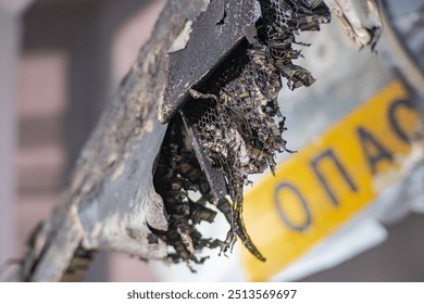 Photo of the texture of black carbon fiber. Carbon dark background of rectangular Black sports film for pasting cars. military carbon fiber. Detail of a crashed military drone carbon fiber honeycombs