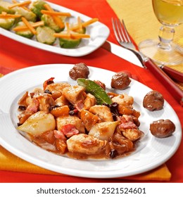 Receita de frango agridoce com damascos secos, passas, figos secos, castanhas, cebolas, bacon e especiarias.