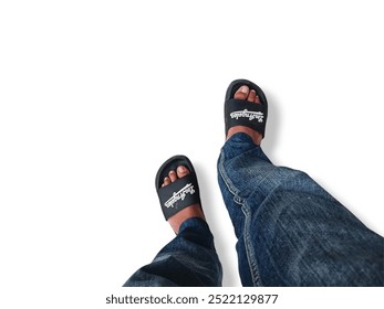 Two legs of a man standing on a white background. Two legs of a man standing