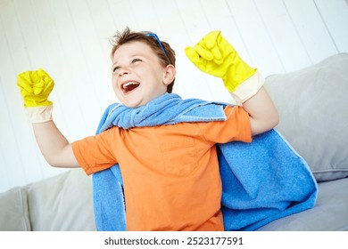 Boy, happy and superhero costume in home with fantasy game, playing and strong pretend character. Kid, person and action fist for child development, adventure and halloween in house with imagination