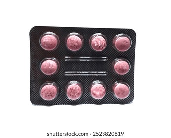 One sheet of red and pink medicinal tablets contains ten pieces isolated on a white background