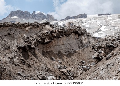 Majestic Kazbegi: A snow-capped peak dominates the rugged landscape, its reflection shimmering in the glacial lake.