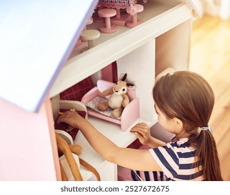 Girl, dollhouse and toys in home for game, fantasy play and fun activity with teddy bears. Child, creativity and imagination in bedroom with dolls, story development and growth with inspiration
