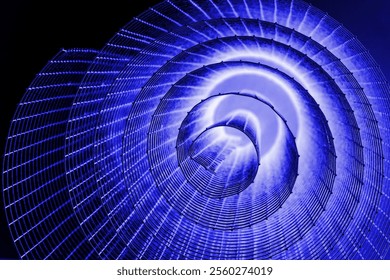Spiral abstrak dengan nuansa biru, ungu muda, ungu, dan tekstur kawat yang berkilau dengan latar belakang hitam, melambangkan energi, gerak, serta konsep desain industrial dan futuristik. Ruang fotokopi