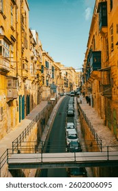 Typical narrow streets with colorful balconies in VallettaTypical narrow streets with colorful balconies. Narrow streets with colourful window boxes in Valetta, Malta Traditional Maltese balconies