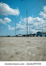 Bright blue sky with street lamp.