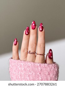 A girl with red chrome nails with glitter and cute designs. Red chrome nails, Glitter nail art,
Cute manicure