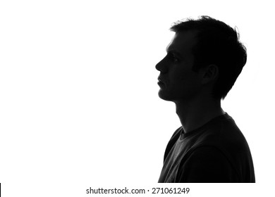 black-and-white silhouette of head of sad caucasian man on a white isolated background