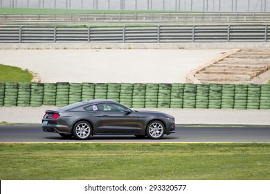 VALENCIA, SPAIN - APRIL 25: A grey 2015 Ford Mustang take part in American Fest weekend organizated in circuit Ricardo Tormo, on April 25, 2015, in Cheste, Valencia, Spain.