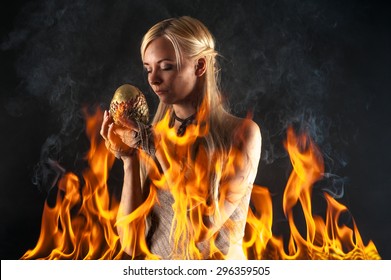attractive woman with a dragon egg in the fire