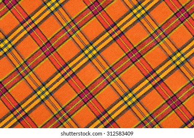 Oranje en gele plaidprint als achtergrond. Schots tartan patroon. Symmetrisch ruitpatroon.