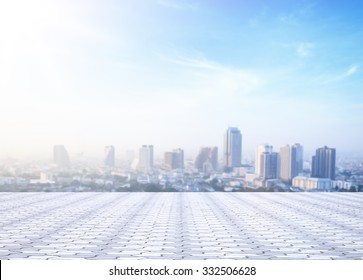 World environment day concept: Stone terrace at rooftop with abstract blur city and blue sky and clouds background. Bangkok, Thailand, Asia