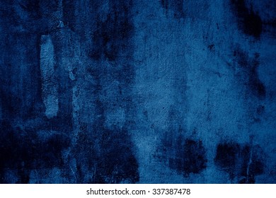 Grunge background of blue concrete wall with scratches