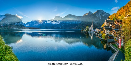 Scenic panoramic picture-postcard view of famous Hallstatt mountain village with Hallstatter See in the Austrian Alps in beautiful golden morning light in fall, Salzkammergut, Austria