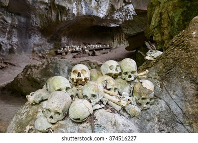 Pile of skulls by the entrance to Tampang Allo burial cave of the royal family. Tana Toraja. South Sulawesi. Indonesia