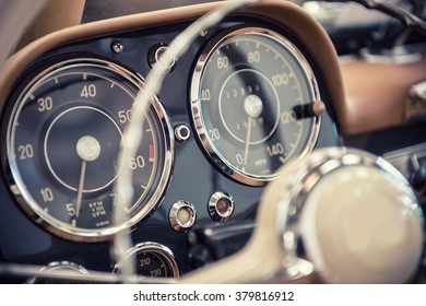 Close up on a dashboard of a vintage car