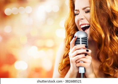 Beautiful Singing Girl. Beauty Woman with Microphone