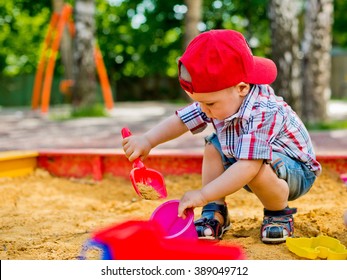 child plays with sand 