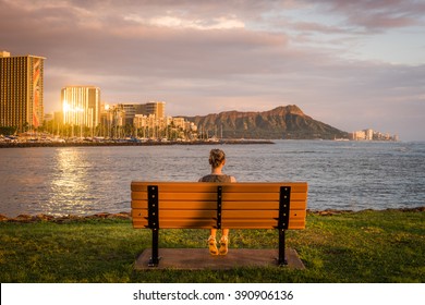 Young woman enjoying Honolulu views from Ala Moana Beach Park