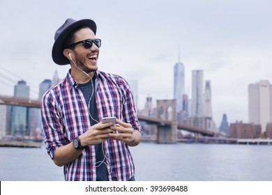 Man listening music with his smartphone in Brooklyn, New York