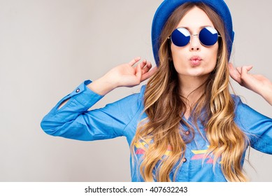 Cool hipster student woman wearing eyewear glasses . Caucasian female university student looking at camera smiling happy.