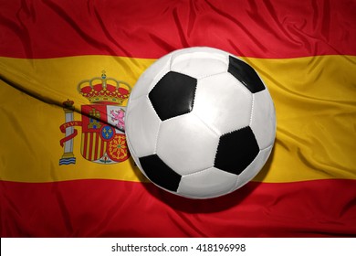  vintage black and white football ball on the national flag of spain