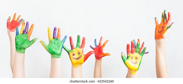 Lot of painted hands raised up. Group of multiracial funny children Funny kids hands up. World Conference for Well-being of Children in Geneva, Switzerland, June 1 Universal Children's Day 20 November