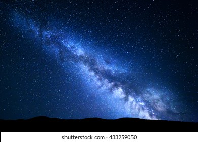 Landscape with blue Milky Way. Night sky with stars and hills at summer. Beautiful universe. Amazing universe. Space background. Beautiful galaxy