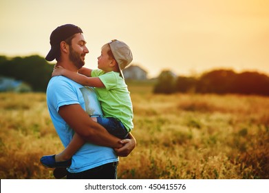 Happy family. Father and son playing and embracing the outdoors. Father's day
